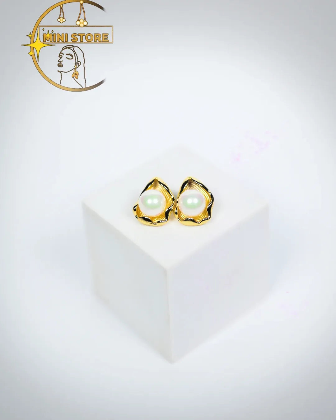 Beauty with their pearl earrings the golden Petal like frame at a quite touch