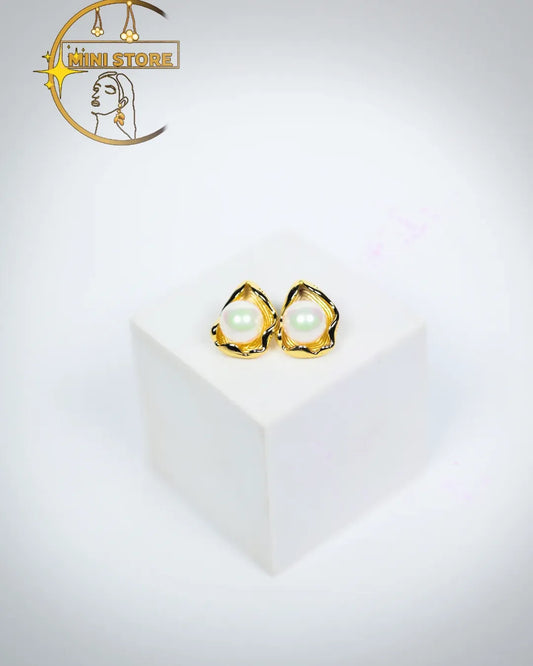 Beauty with their pearl earrings the golden Petal like frame at a quite touch