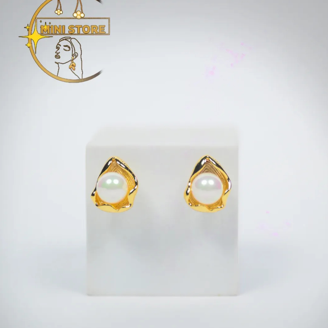Beauty with their pearl earrings the golden Petal like frame at a quite touch