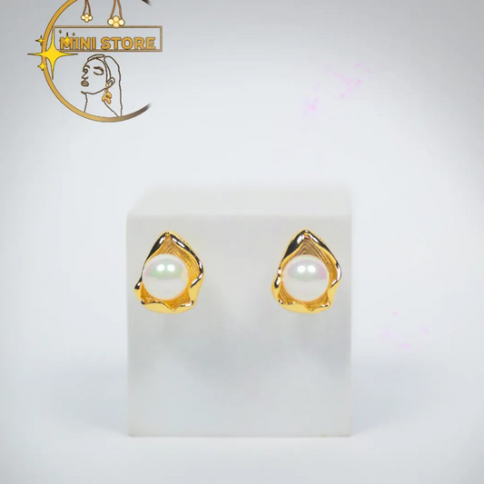 Beauty with their pearl  earrings the golden Petal like frame at a quite touch